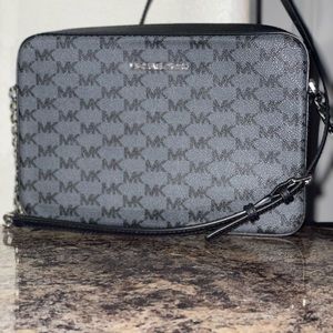Michael Kors purse with sliver chain.